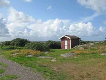 House on landscape against sky