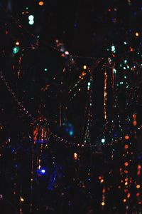 Low angle view of illuminated sky at night