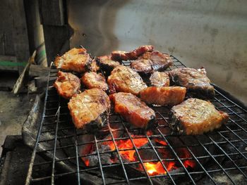 Close-up of meat on barbecue grill