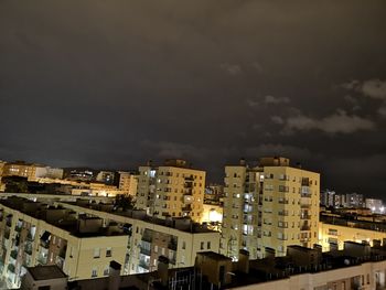 High angle view of illuminated buildings against sky