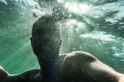 Man swimming in sea