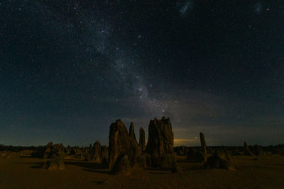 Scenic view of field against sky at night