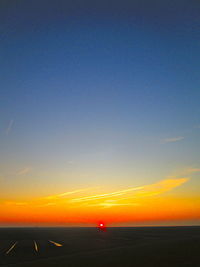 Scenic view of sea against clear sky during sunset