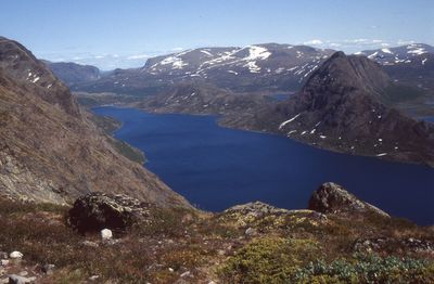 Scenic view of lake and mountains against sky