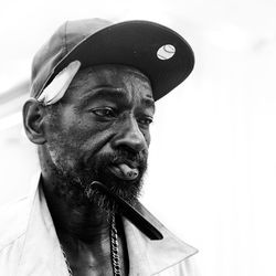 Portrait of man wearing hat looking away