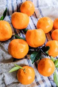 High angle view of oranges on fabric