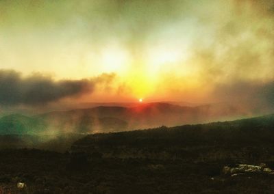 Scenic view of landscape at sunset