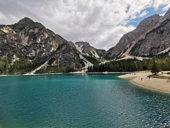 Scenic view of lake and mountains against sky