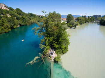 High angle view of trees by lake against sky