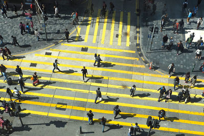 High angle view of people crossing road
