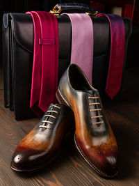 Close-up of shoes on hardwood floor