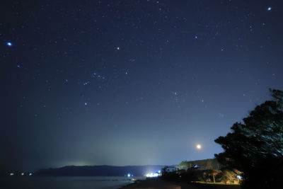 Low angle view of star field against sky at night