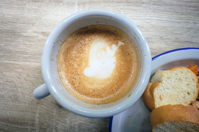 High angle view of coffee served on table