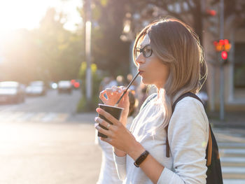 Young woman drinking glass