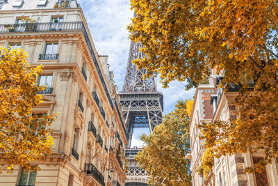 Low angle view of eiffel tower against sky during autumn