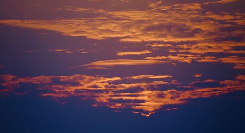 Low angle view of clouds in sky during sunset