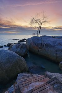 Scenic view of sea against sky at sunset