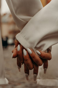   hands holding each other - couple in love