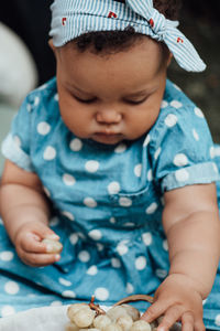 Close-up of cute boy holding baby girl