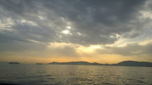 Scenic view of sea against cloudy sky