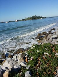 Scenic view of sea against blue sky