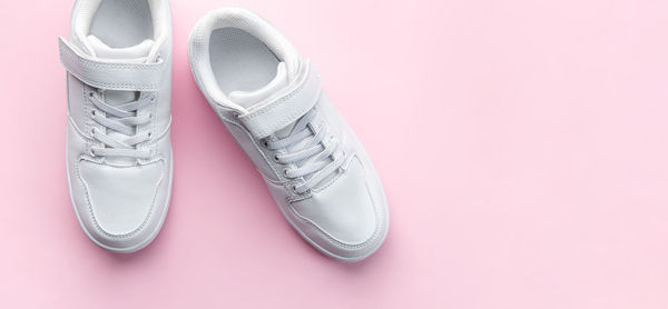 Close-up of shoes against white background
