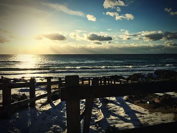 Scenic view of sea against sky at sunset