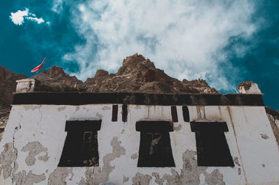 Low angle view of old building against sky