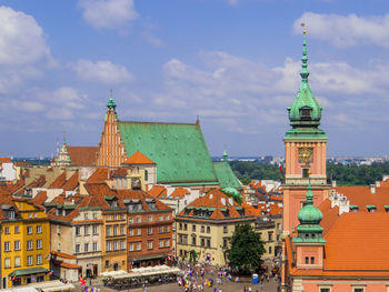 Buildings in city against sky