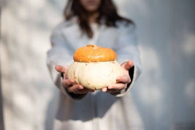 Midsection of person holding ice cream