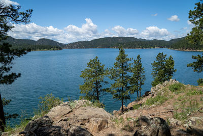 Scenic view of lake and mountains against sky