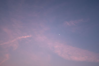 Low angle view of vapor trails in sky