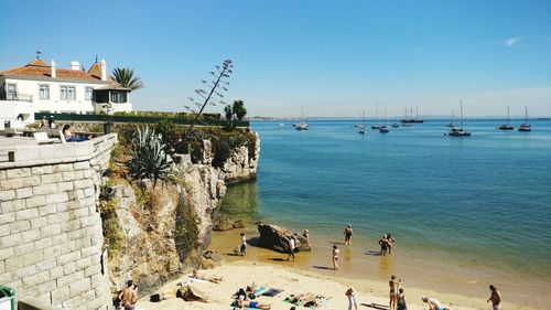 High angle view of people enjoying at beach