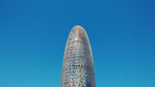 Low angle view of tower against clear blue sky