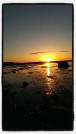 Scenic view of sea at sunset