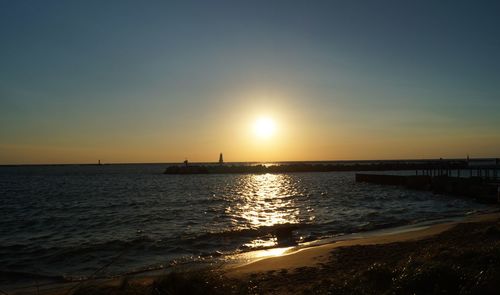 Scenic view of sea against sky at sunset