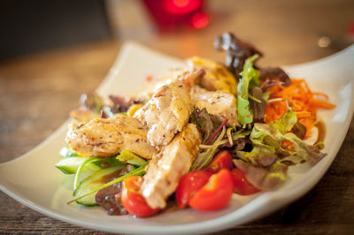 Salad in plate on table