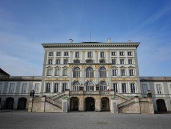 Low angle view of building against blue sky - schloss nymphenburg