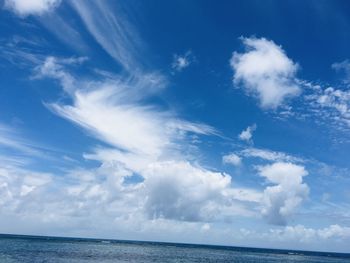 Low angle view of sea against blue sky