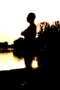 Silhouette man against sky during sunset