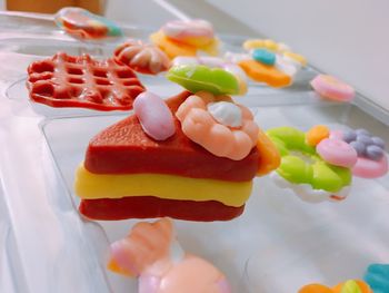 Close-up of multi colored candies on table