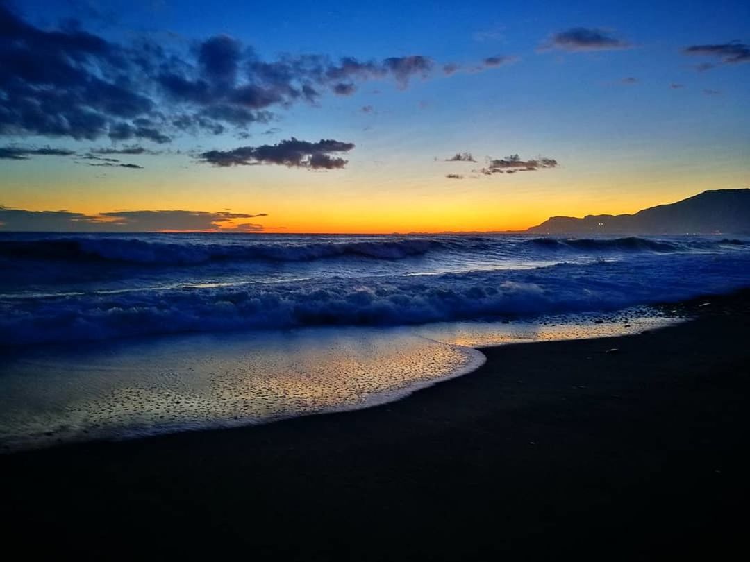 sea, beauty in nature, sunset, nature, scenics, wave, beach, sky, water, horizon over water, tranquil scene, tranquility, no people, outdoors, cloud - sky, motion, power in nature, day