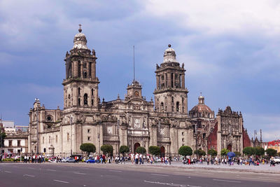 Group of people in front of historical building