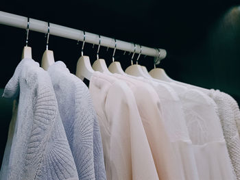 Close-up of clothes hanging on rack