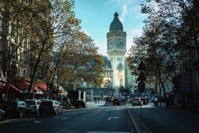 Street amidst trees and buildings in city