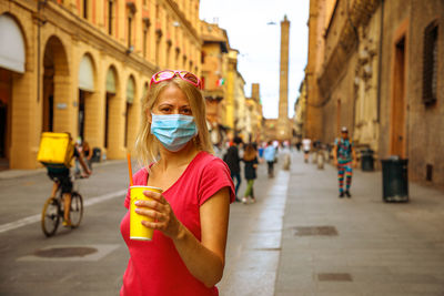 Portrait of woman on street in city