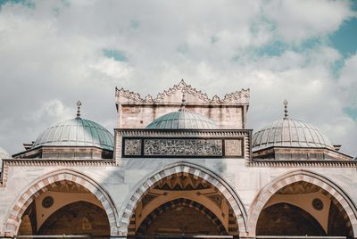 Low angle view of mosque against sky