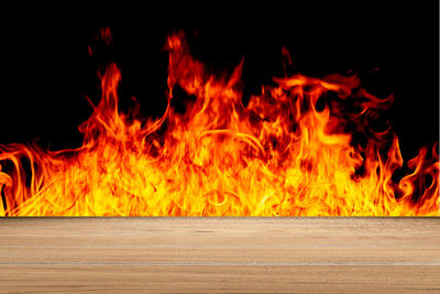 Close-up of fire burning at night