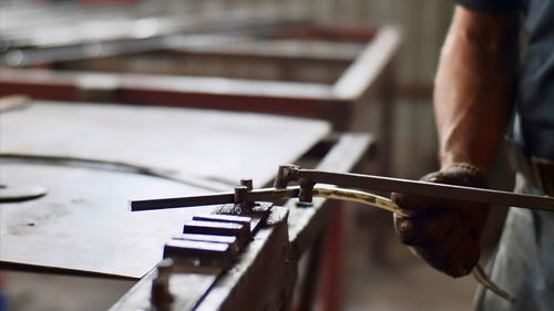 Midsection of man playing piano