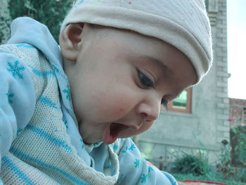 Close-up portrait of boy looking at winter